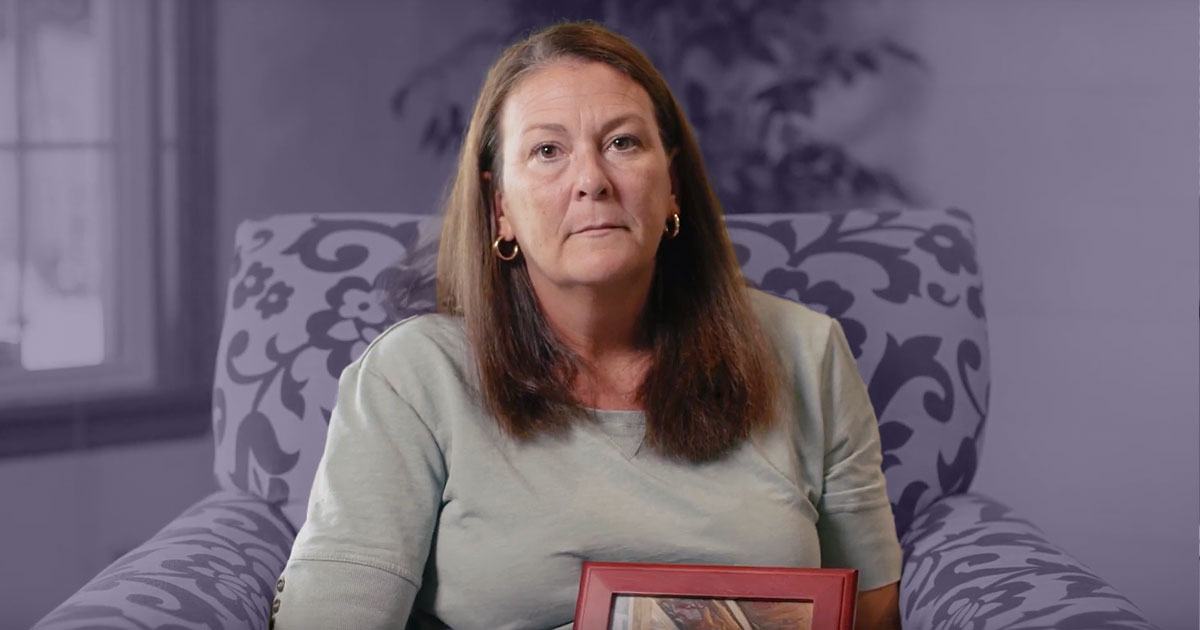 Abby Gillette holding a photo of her father